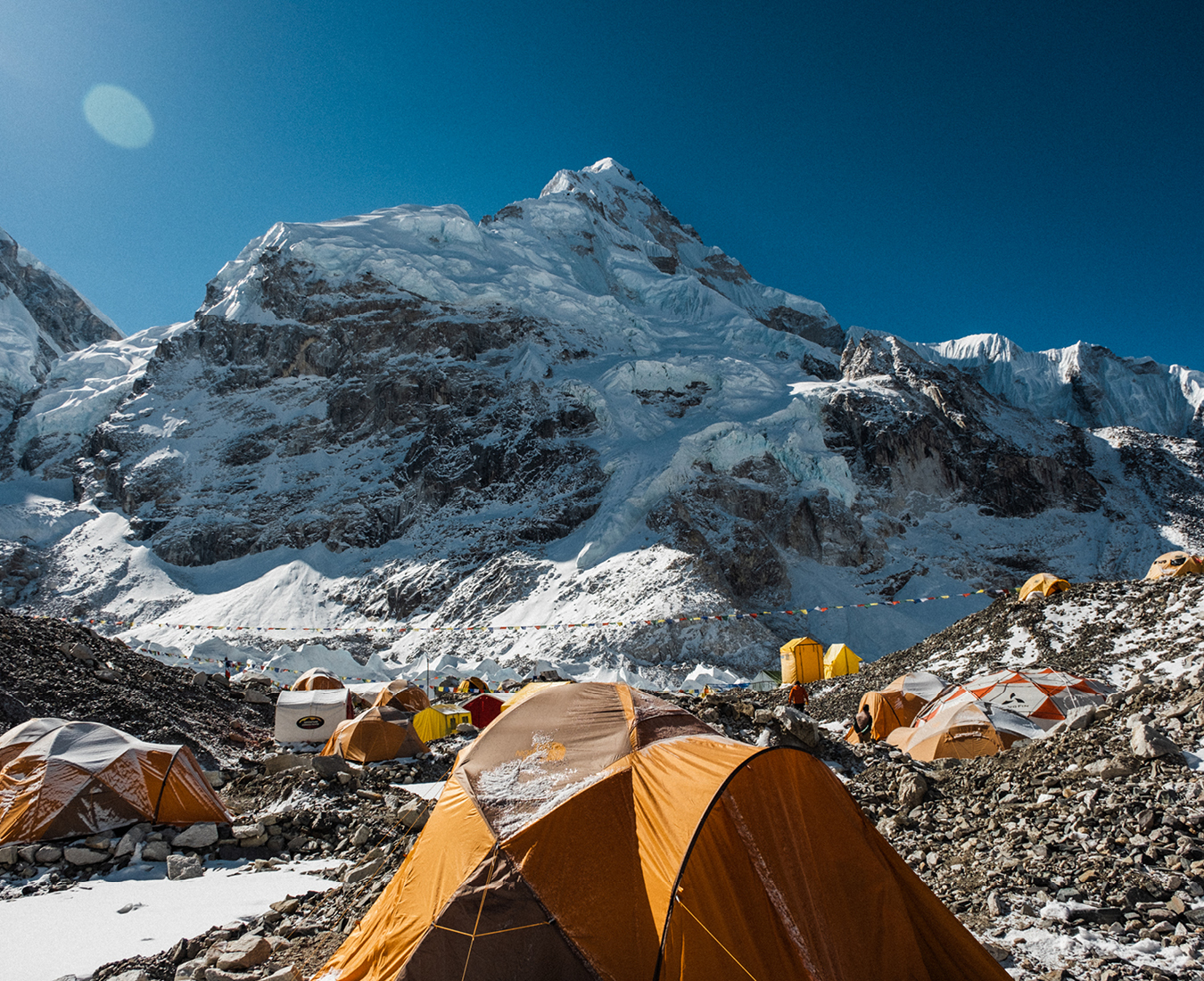 The AC tents at Everest Base Camp positioned alongside the Khumbu Icefall and under the shadow of Mount Nuptse.